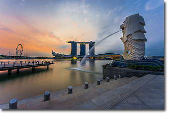 Singapore Merlion with Resort World Sentosa and Singapore Flyer in the background Concept Voyages